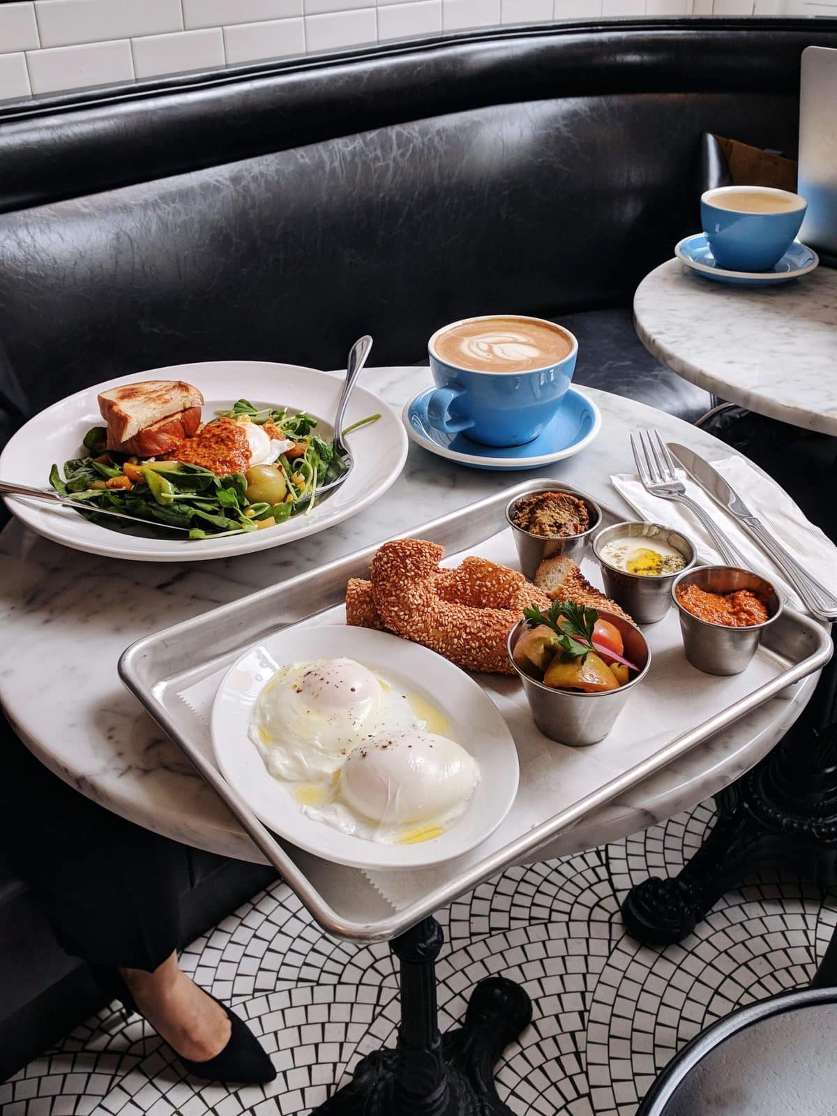 A salad, platter, and coffee at Tatte Bakery in Boston