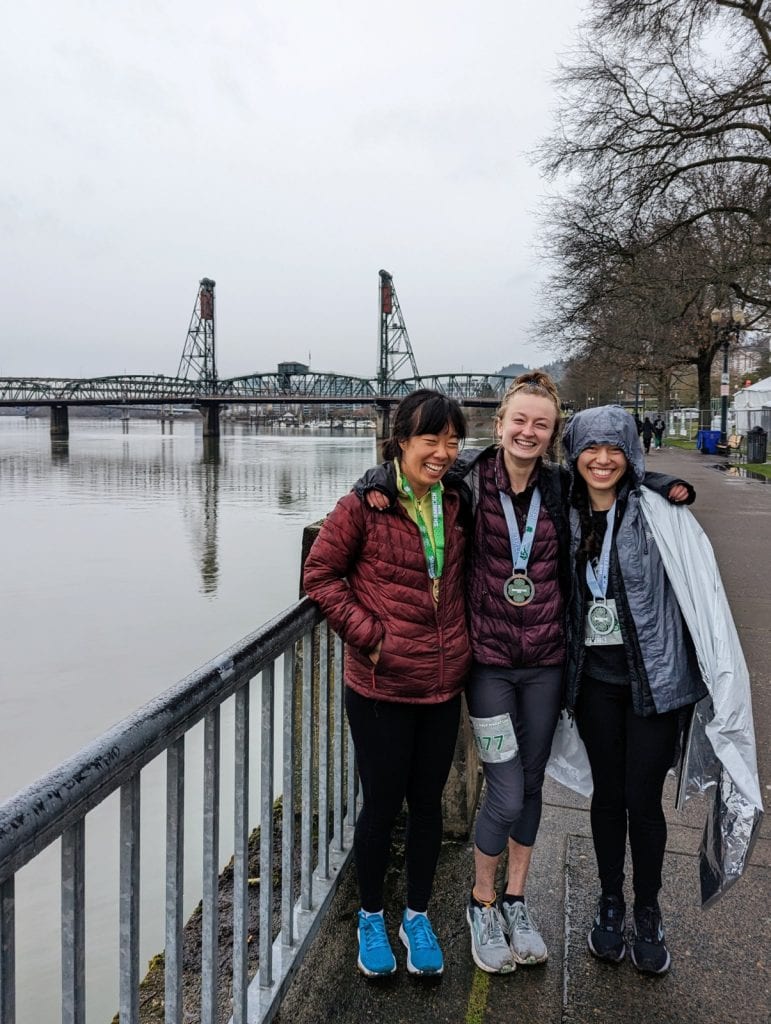 Me and my friends posing by the river after our races