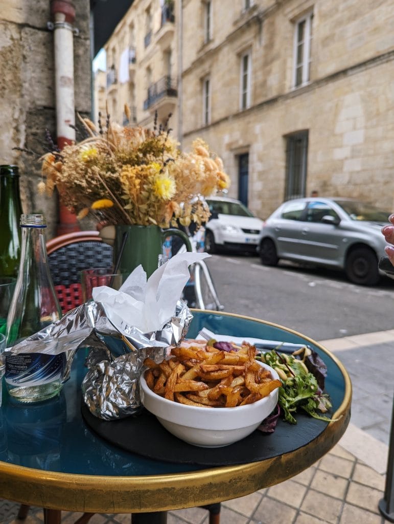 Fries and flowers on a table