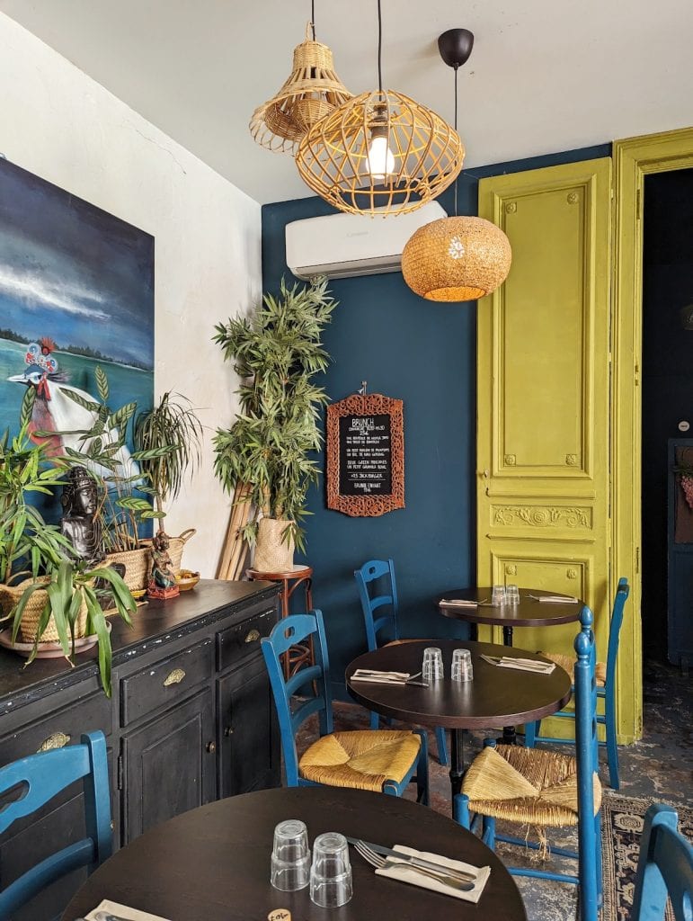 Interior of Monkey Mood with blue walls and chairs