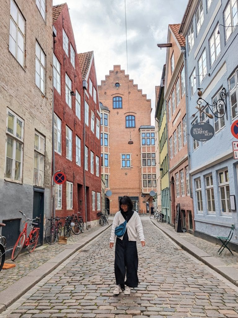 Me walking down Magstraede in Copenhagen, a colorful street
