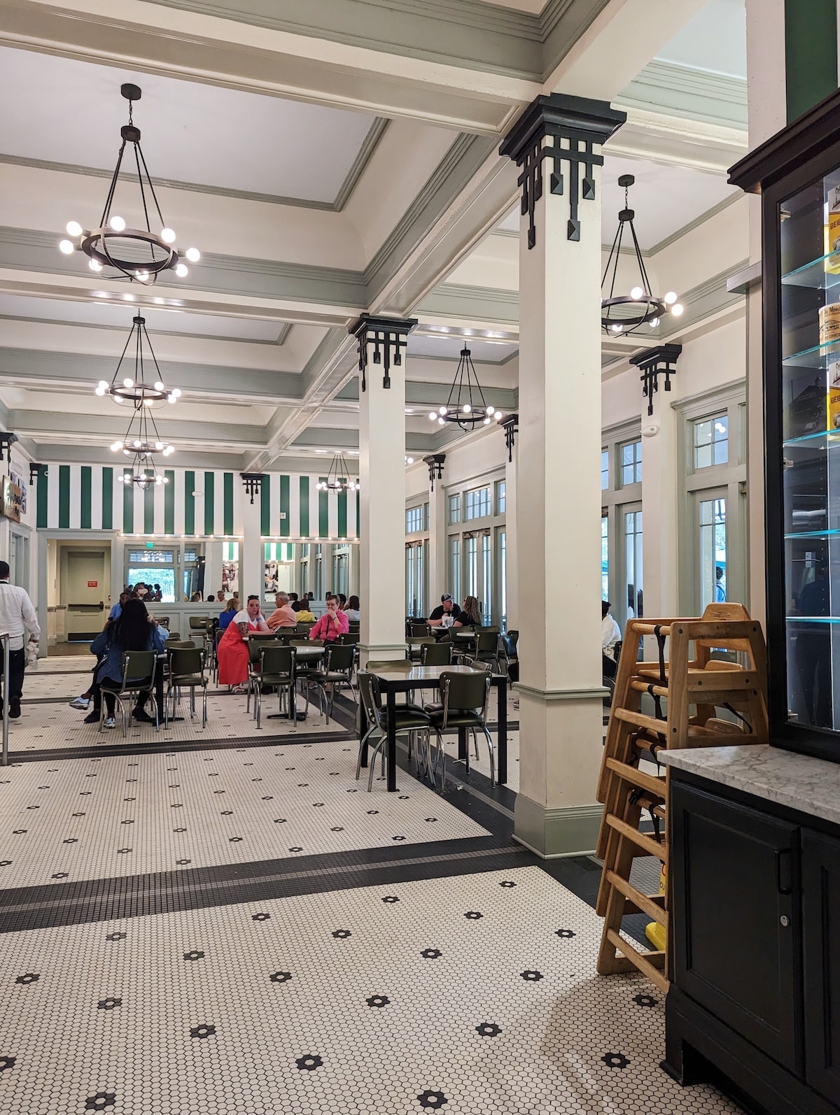 Interior of Cafe du Monde City Park with teal accents and tile floors