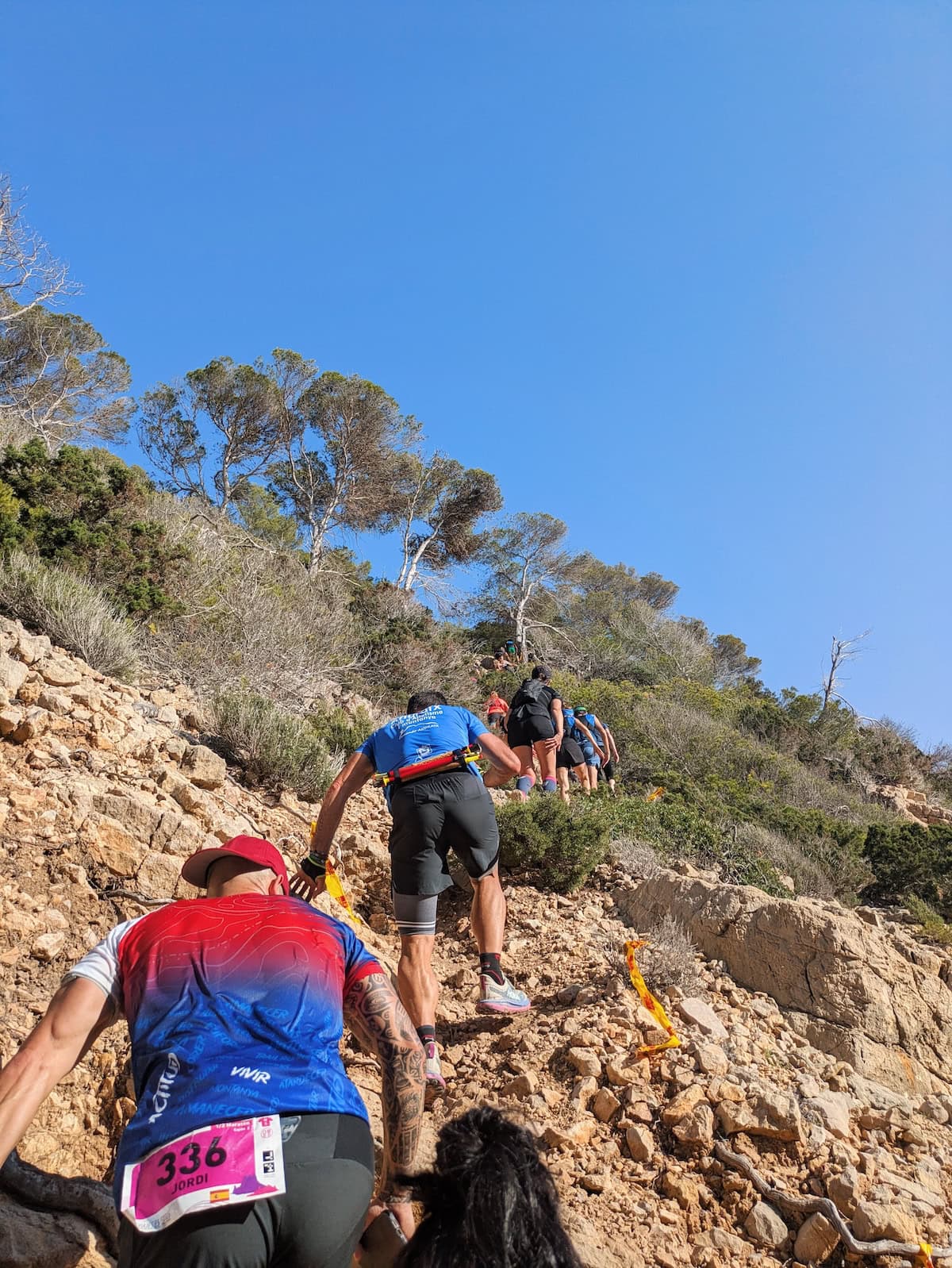 Scrambling uphill during the 3 Dias Trail Ibiza