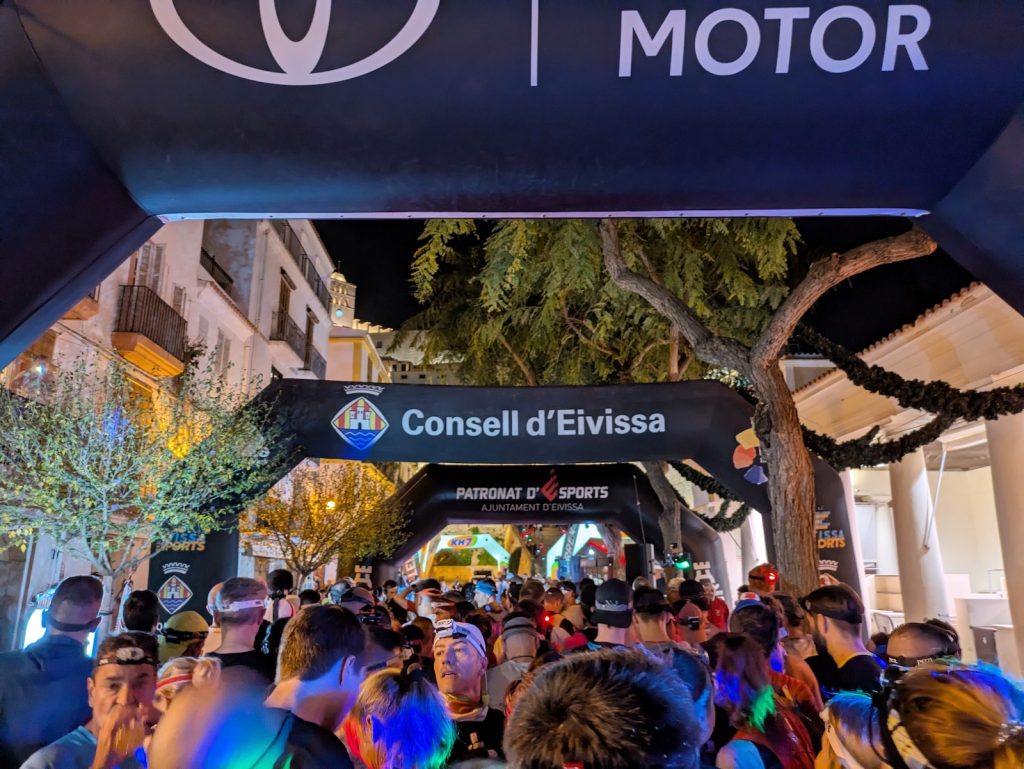 Start line of the 3 Dias Trail Ibiza with colorful lights and headlamps