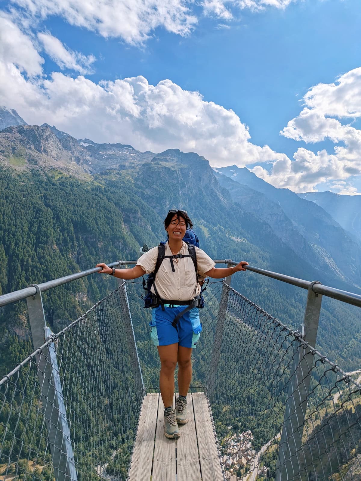 Me wearing blue Patagonia colorblock shorts I thrifted on a mountain platform