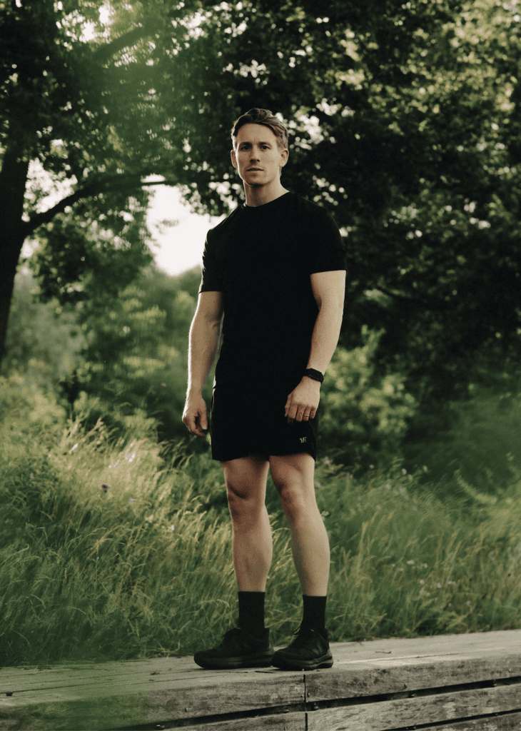 Man wearing black shirt and shorts