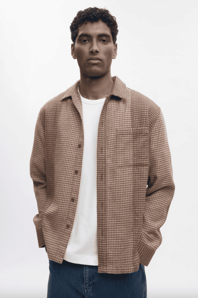 Man wearing a Kotn shacket over a white tee