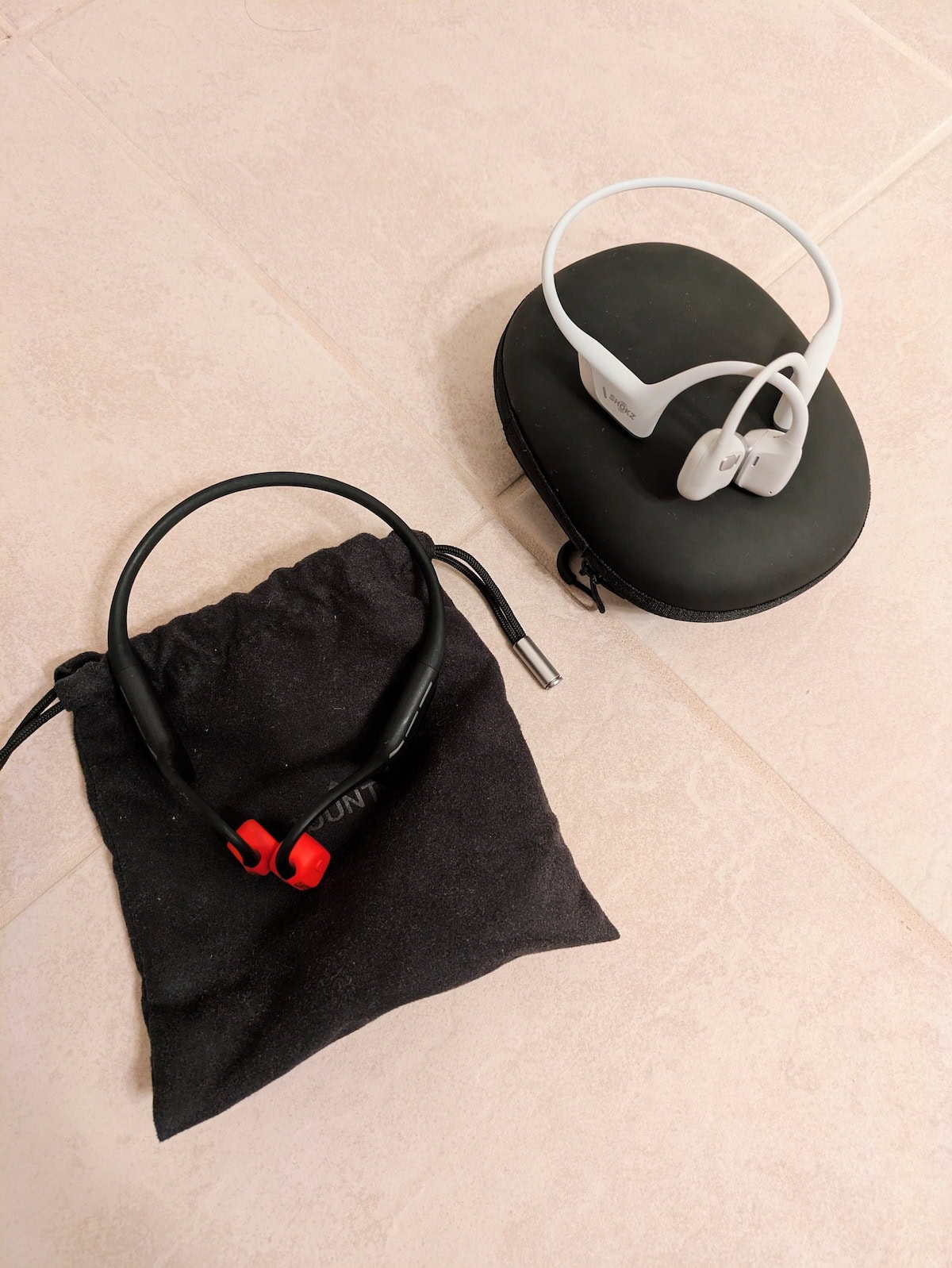 Suunto Wing with case and Shokz OpenRun Pro 2 with case