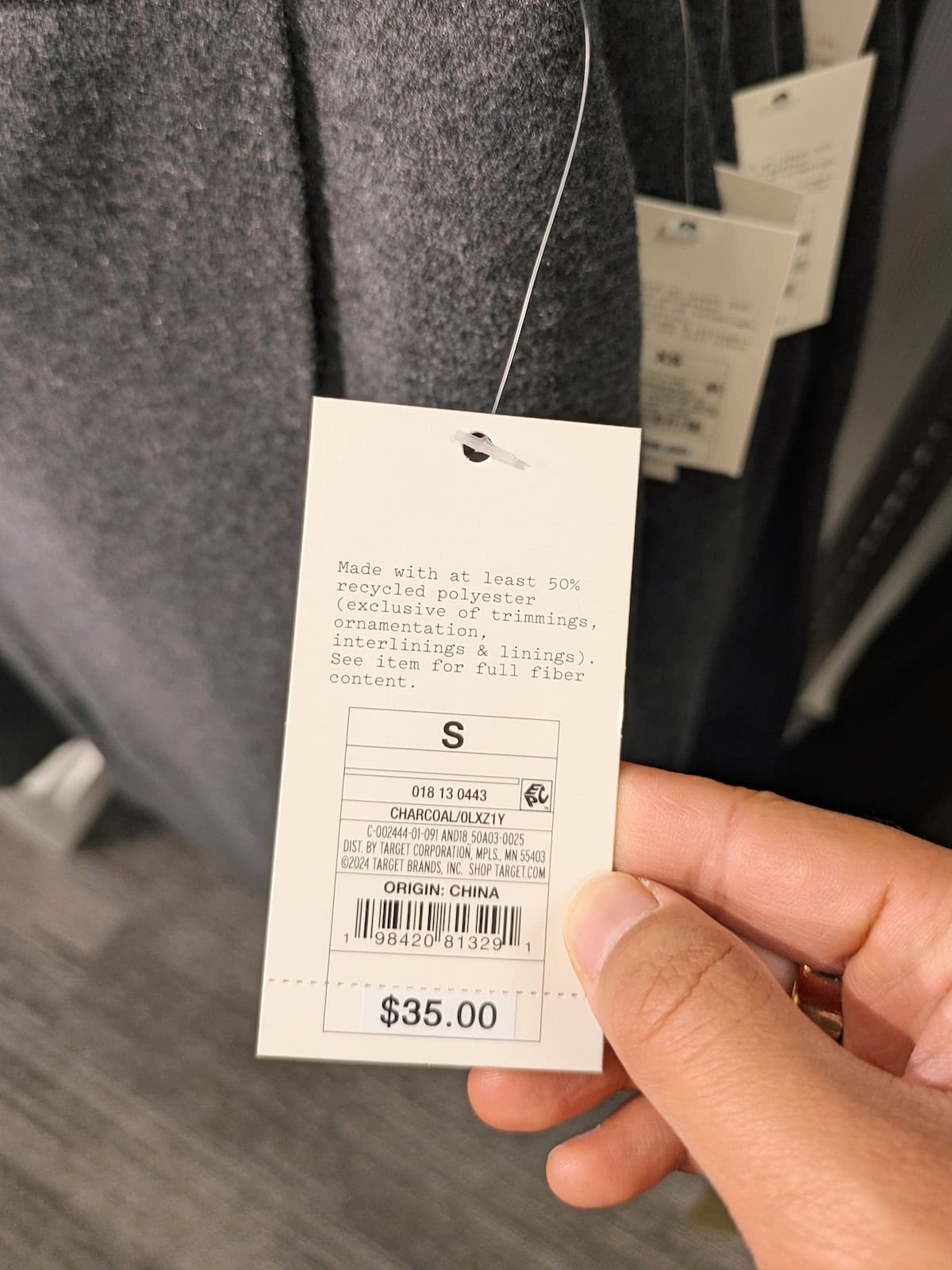 Example of hang tag listing recycled polyester contents at Target