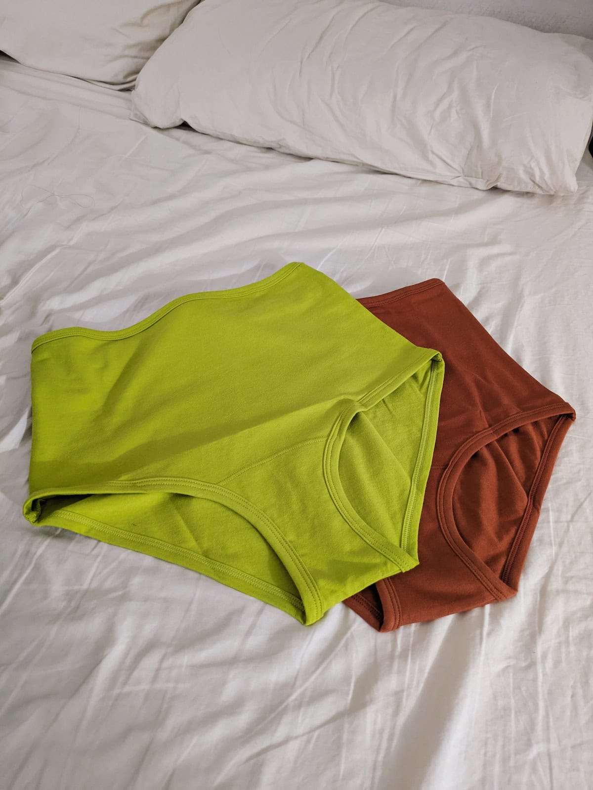 2 pairs of ARQ underwear on the bed