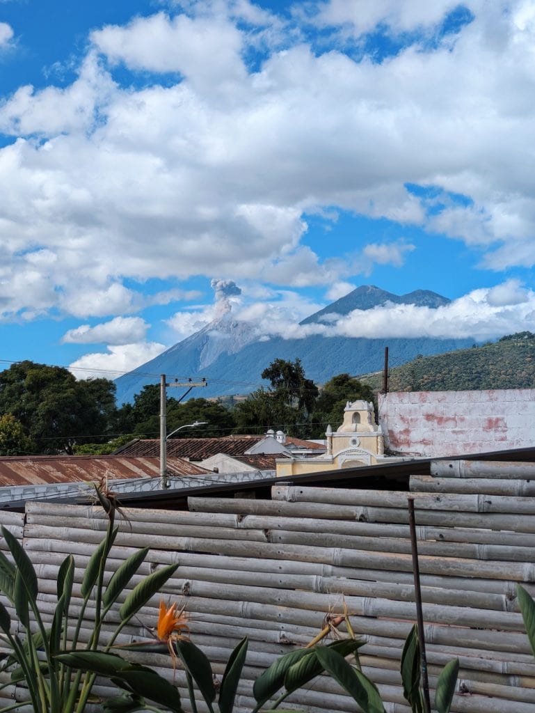 View of Fuego erupting from La Boheme rooftop terrace