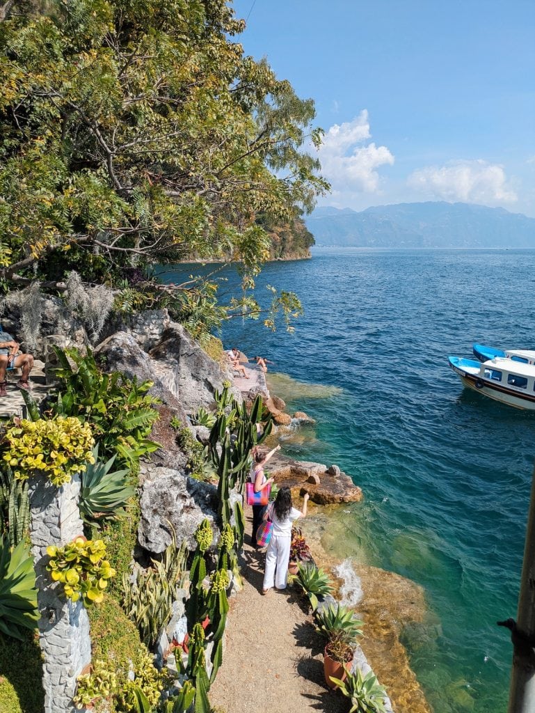 La Casa del Mundo swimming area with cacti and turquoise waters