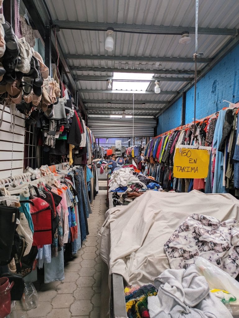 Piles of clothing in the secondhand clothing market in Antigua