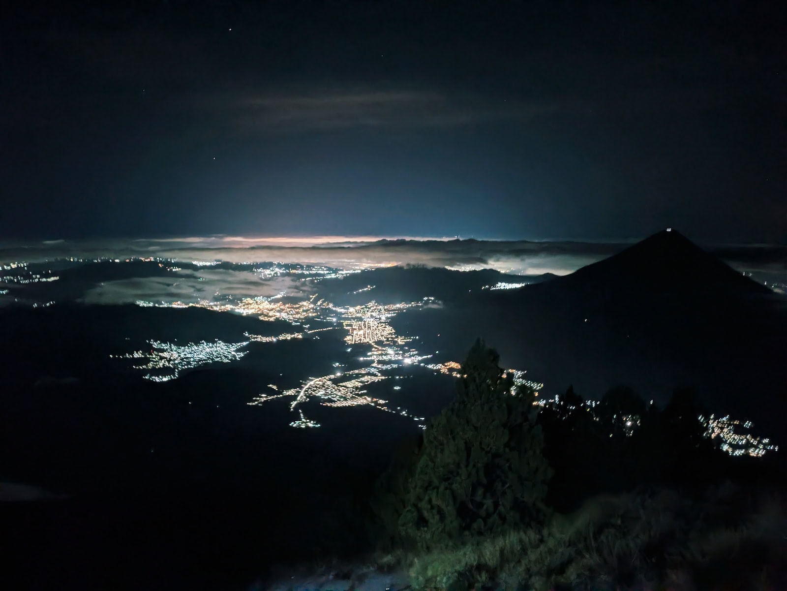 Hiking in the dark for the sunrise hike on Acatenango. This is a view of the city lights from afar
