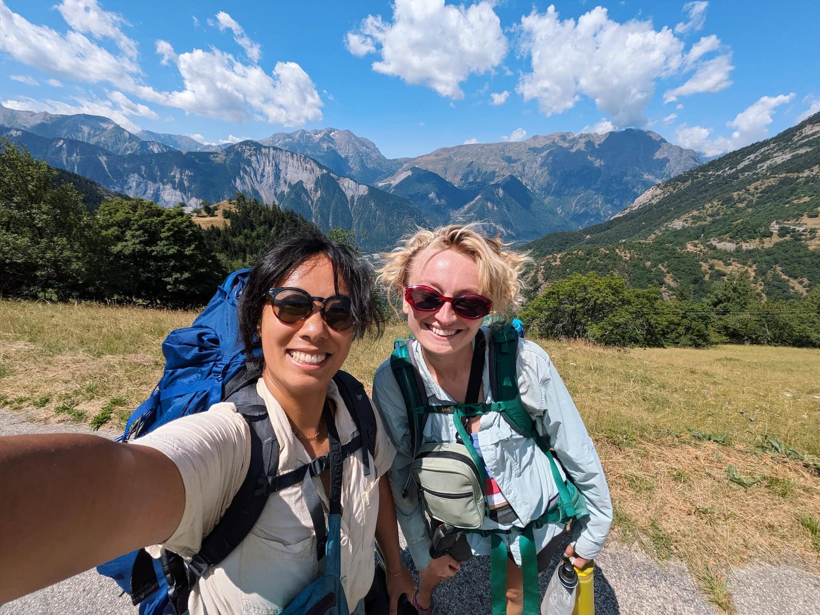 Me and my friend Tessa on Day 1 of the GR54 with mountains in the background
