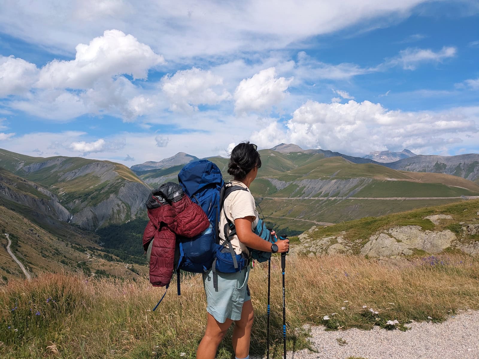 Me looking towards the mountains at Col de Sarenne with my bulky backpack on