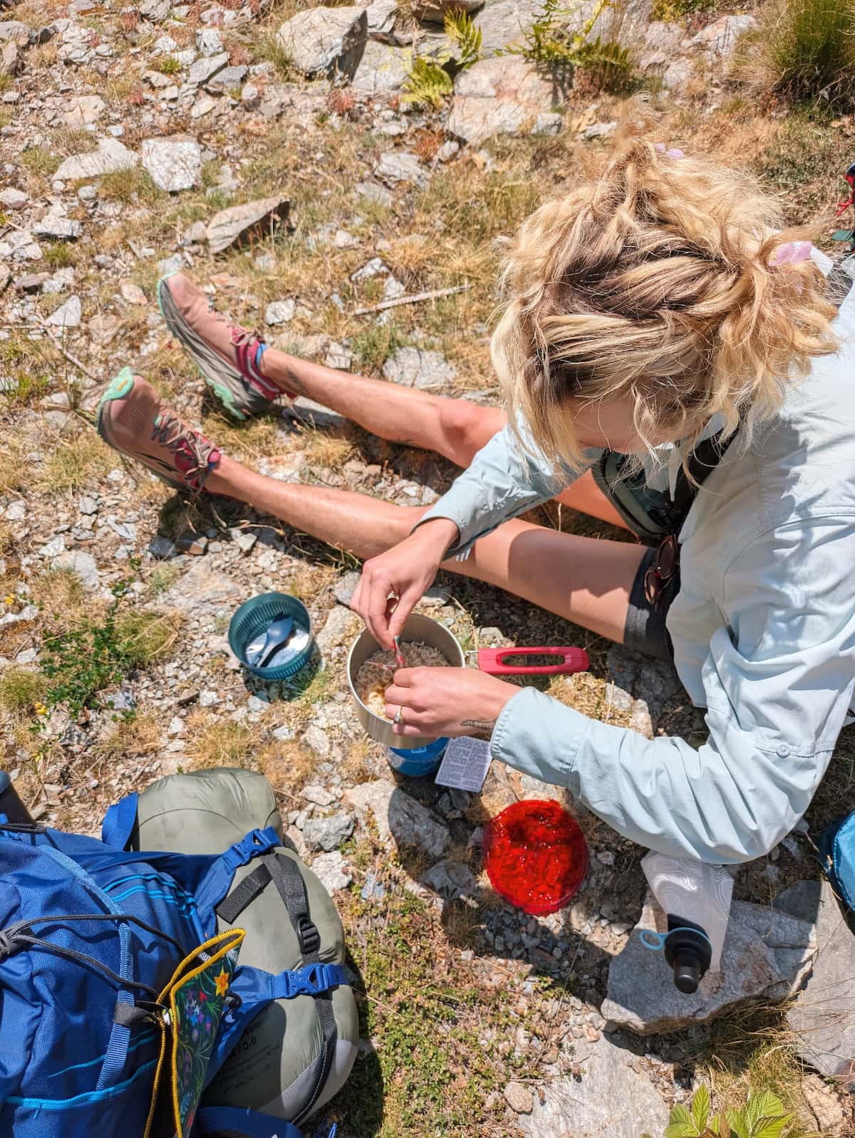 Birds-eye view of Tessa making ramen on the trail