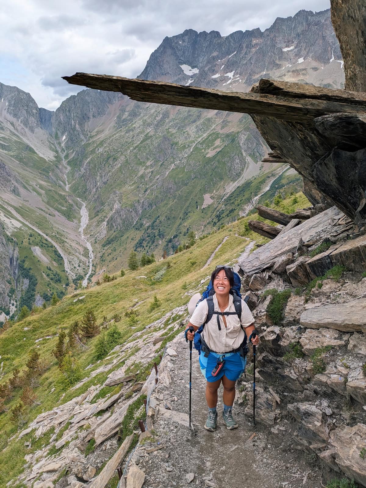 Me looking up at an overhang of rocks