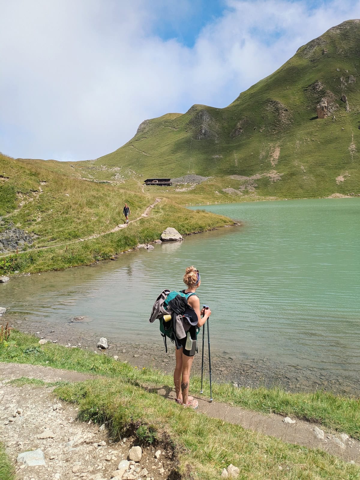 Tessa looking out at Lac de la Muzelle with mint water