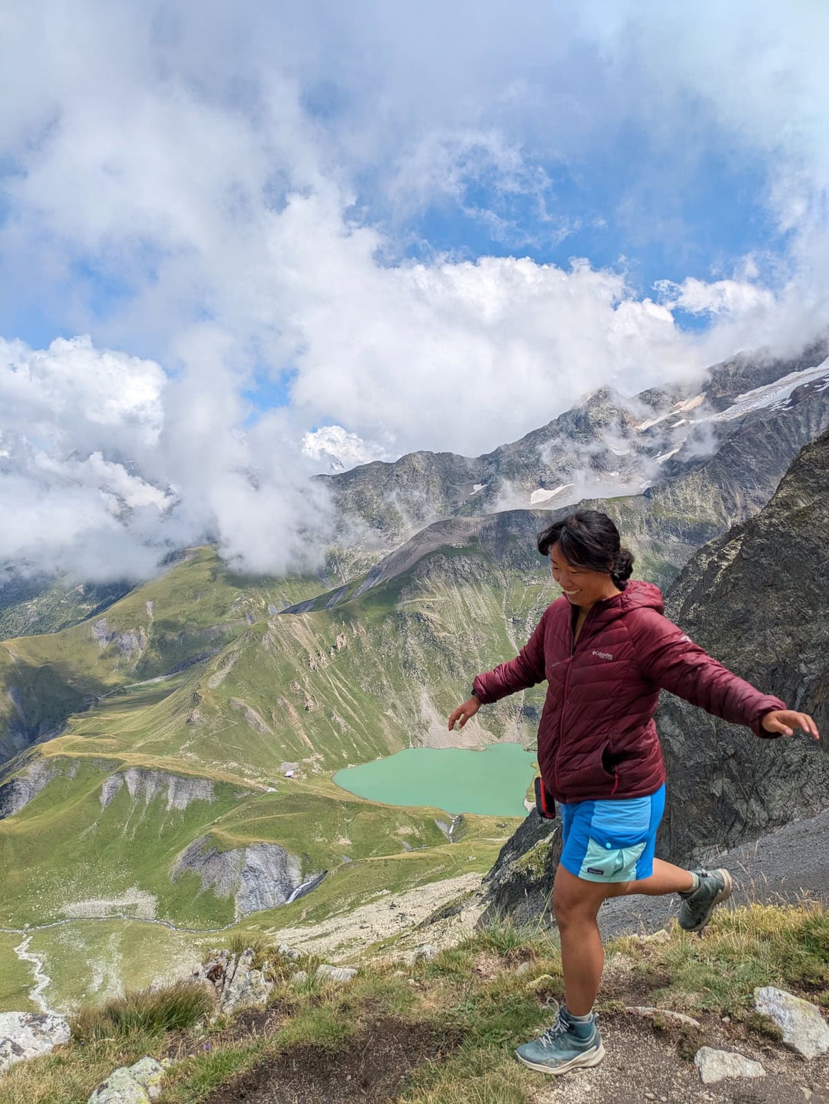 Me jumping with Lac de la Muzelle below and in the distance