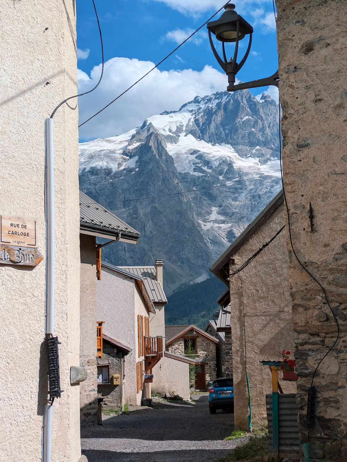Snow-capped mountains peeking through a tiny French village