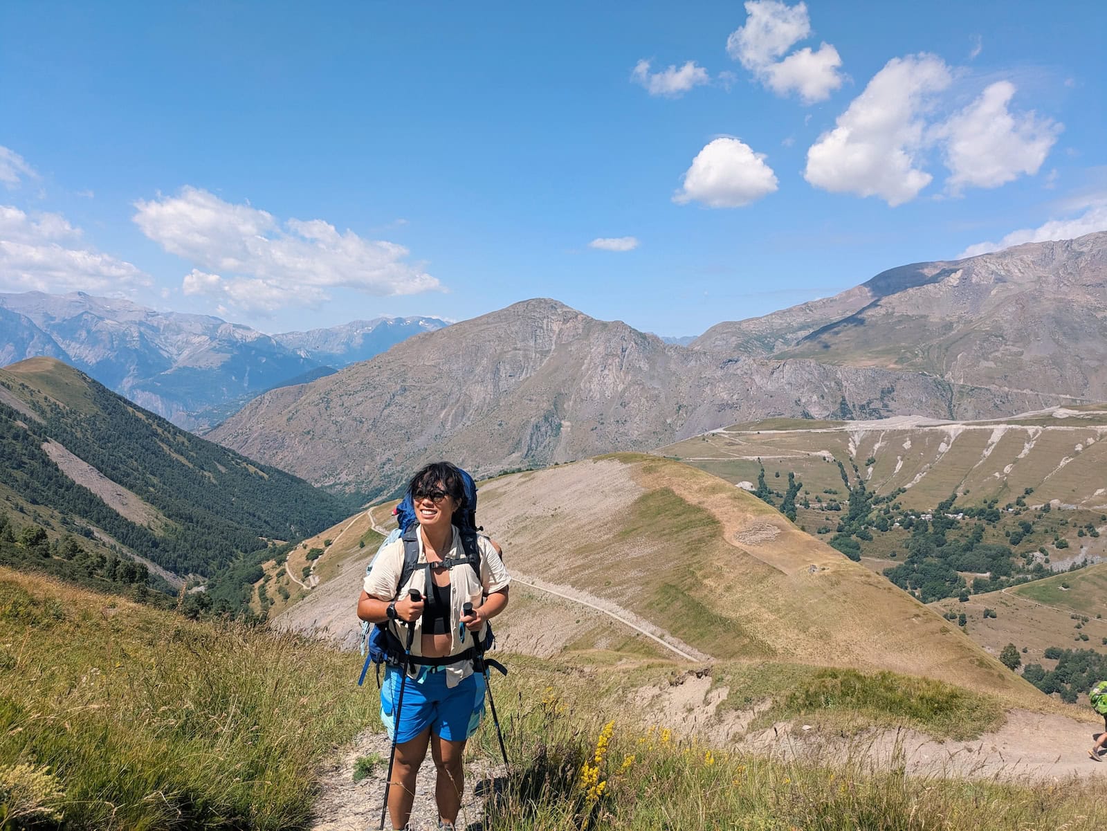 Grassy mountain views behind me as I climb up switchbacks