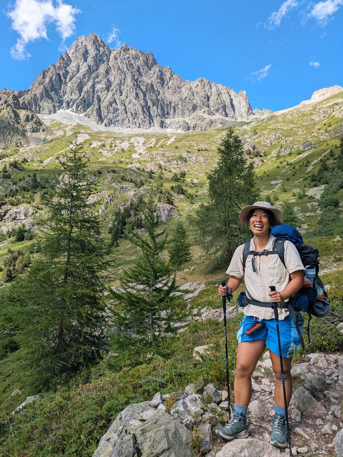 Photo of me with craggy peaks in the background