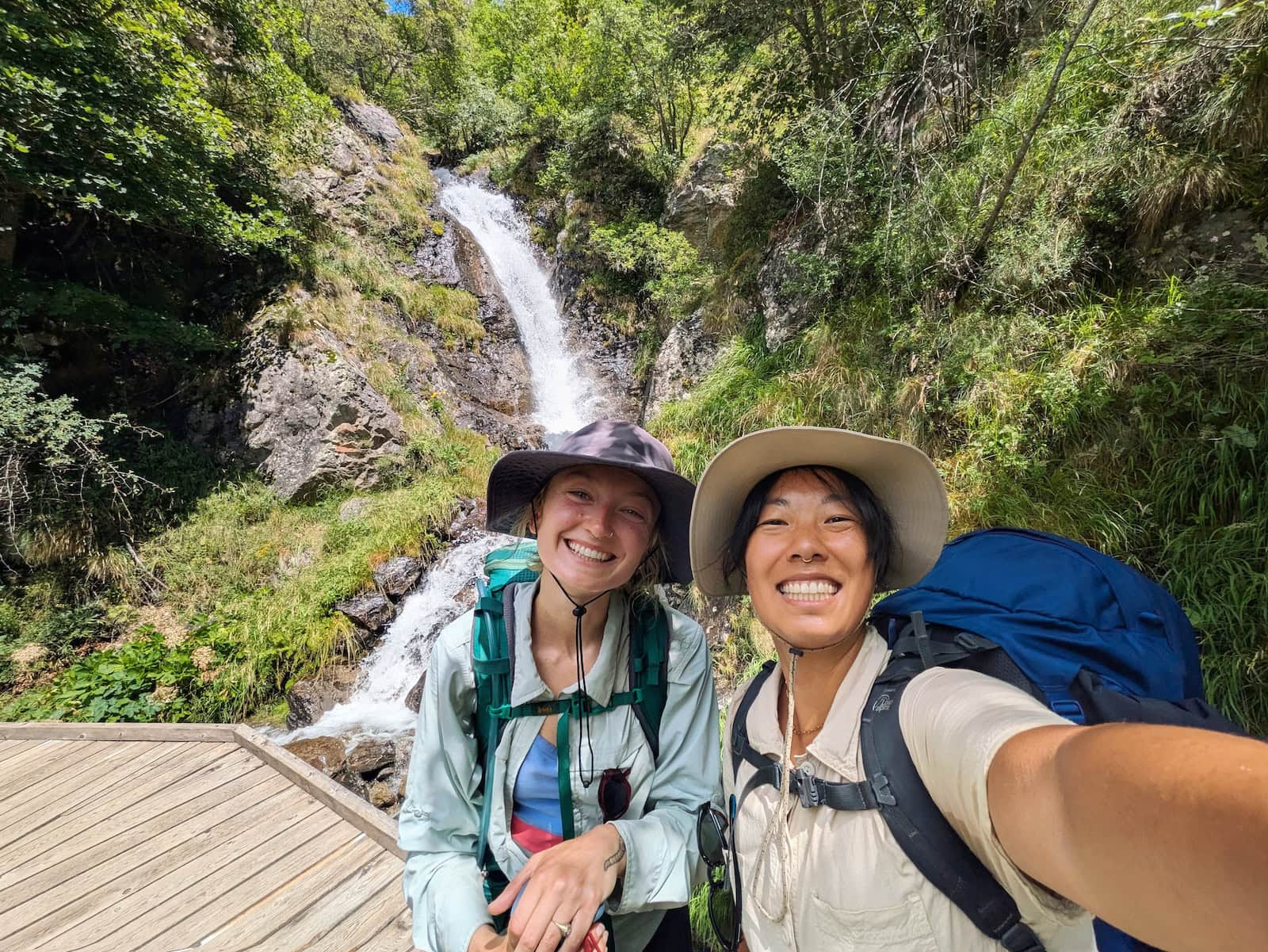 Selfie of me and Tessa with a small waterfall in the background