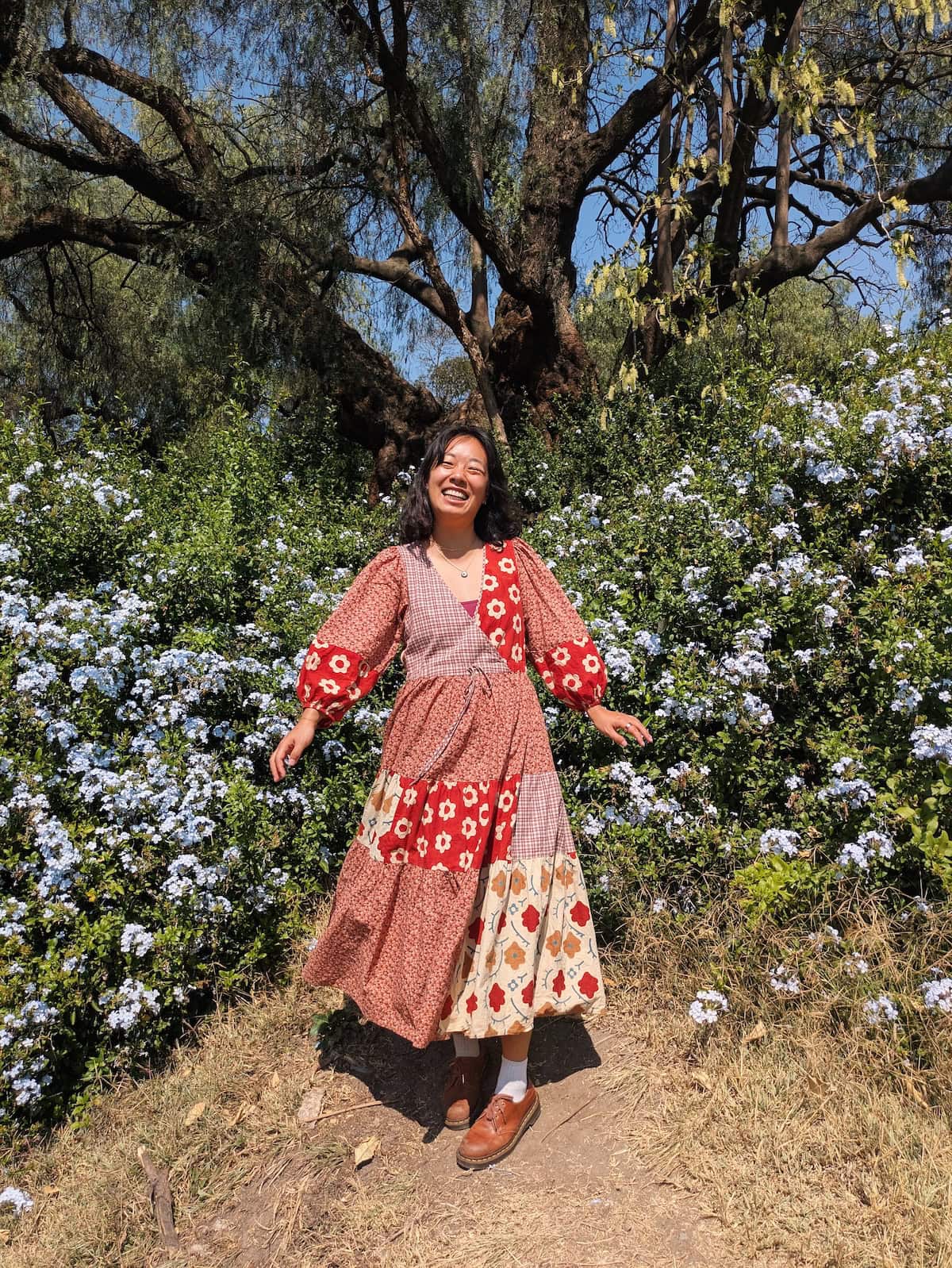 Me wearing a red patchwork dress from Christy Dawn