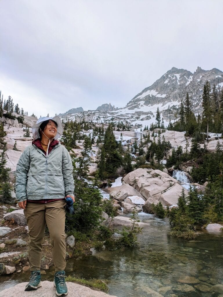 Me standing in front of waterfalls on the Alice-Toxaway Loop