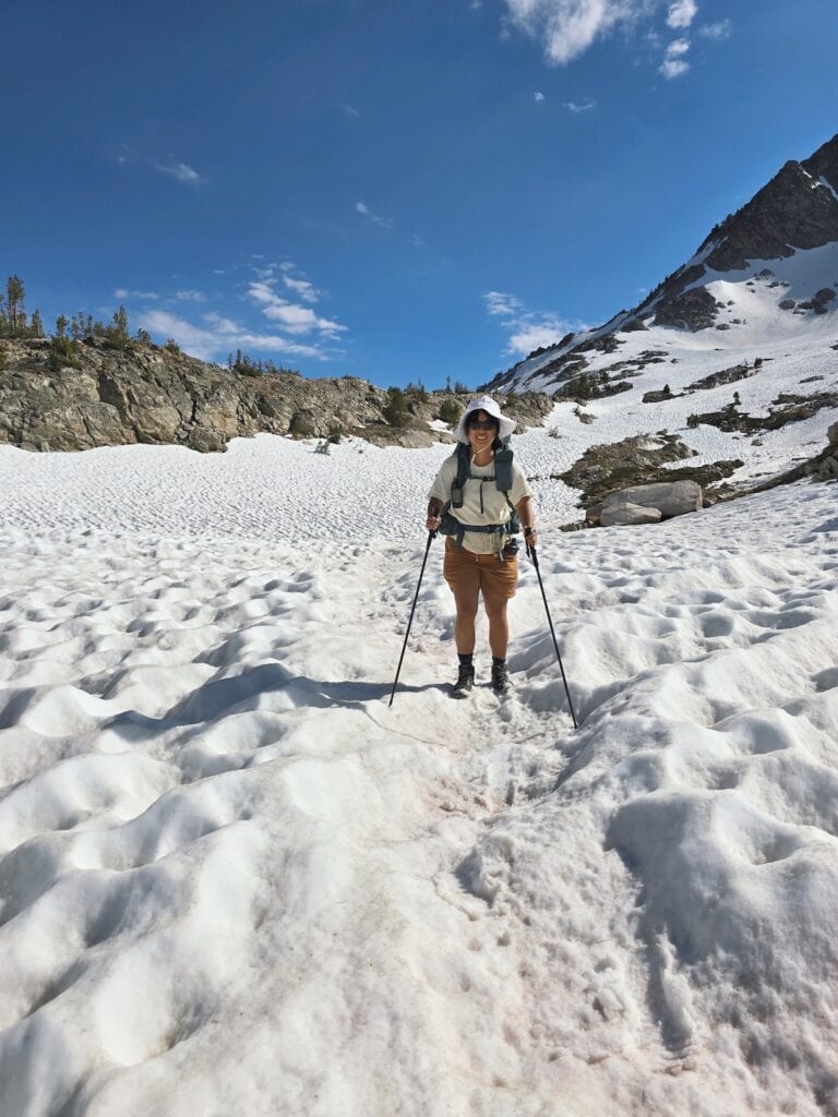 Hiking down snow on the Alice-Toxaway Loop
