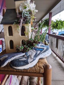 Running shoe repurposed into a succulent planter